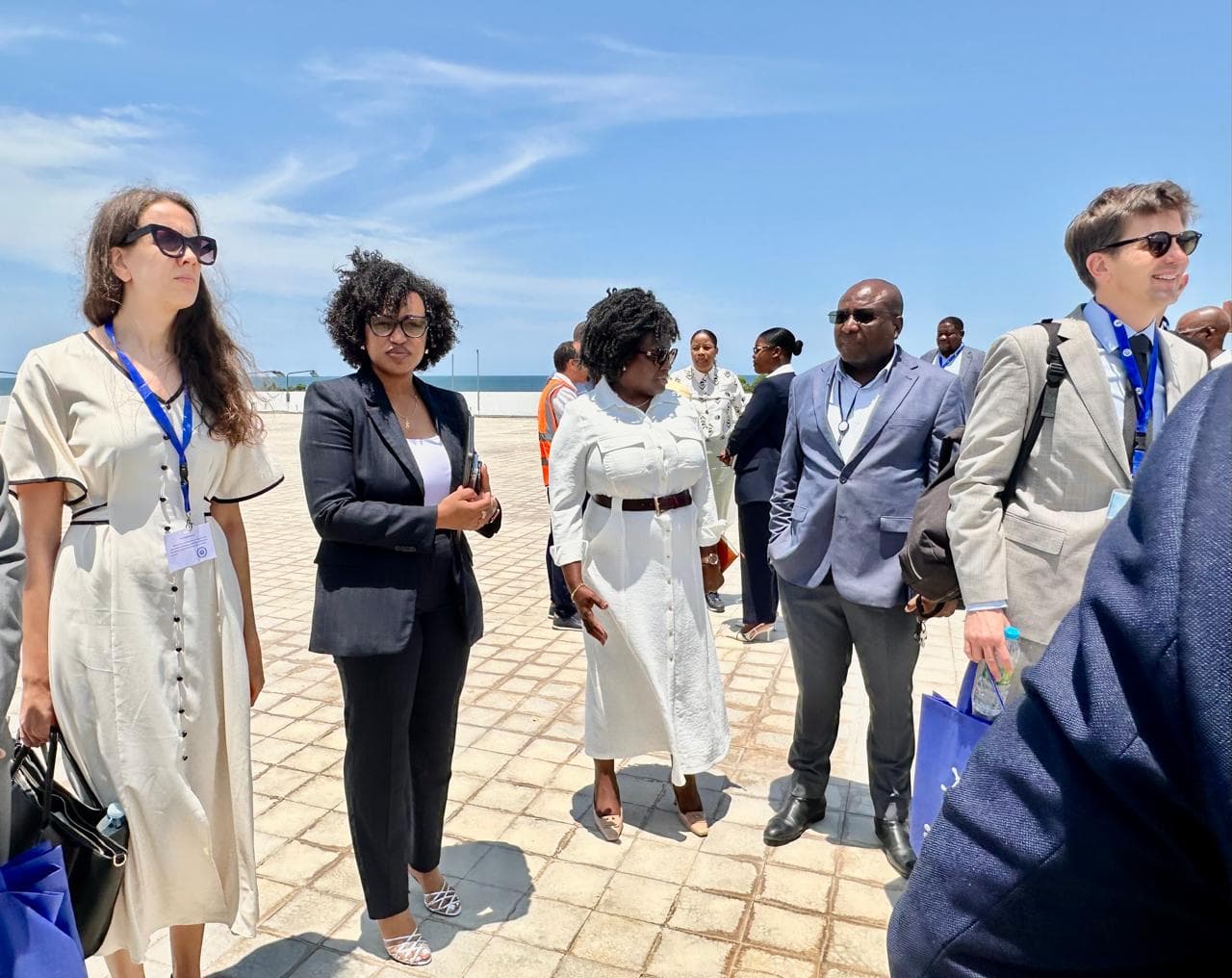 Delegation walking a coastal site during a field visit